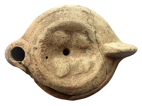 Round oil-lamp from terracotta with an image of Isis and Serapis
